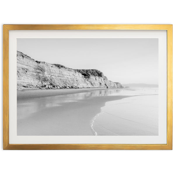 a black and white photo of a beach