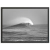 a black and white photo of a wave in the ocean