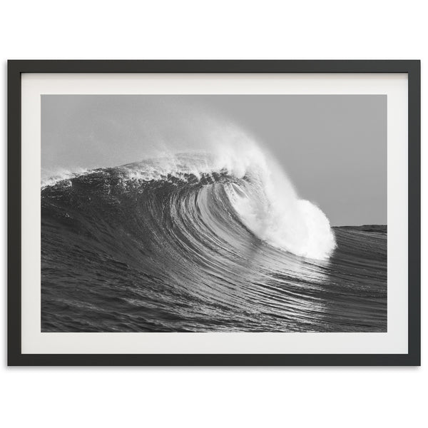 a black and white photo of a wave