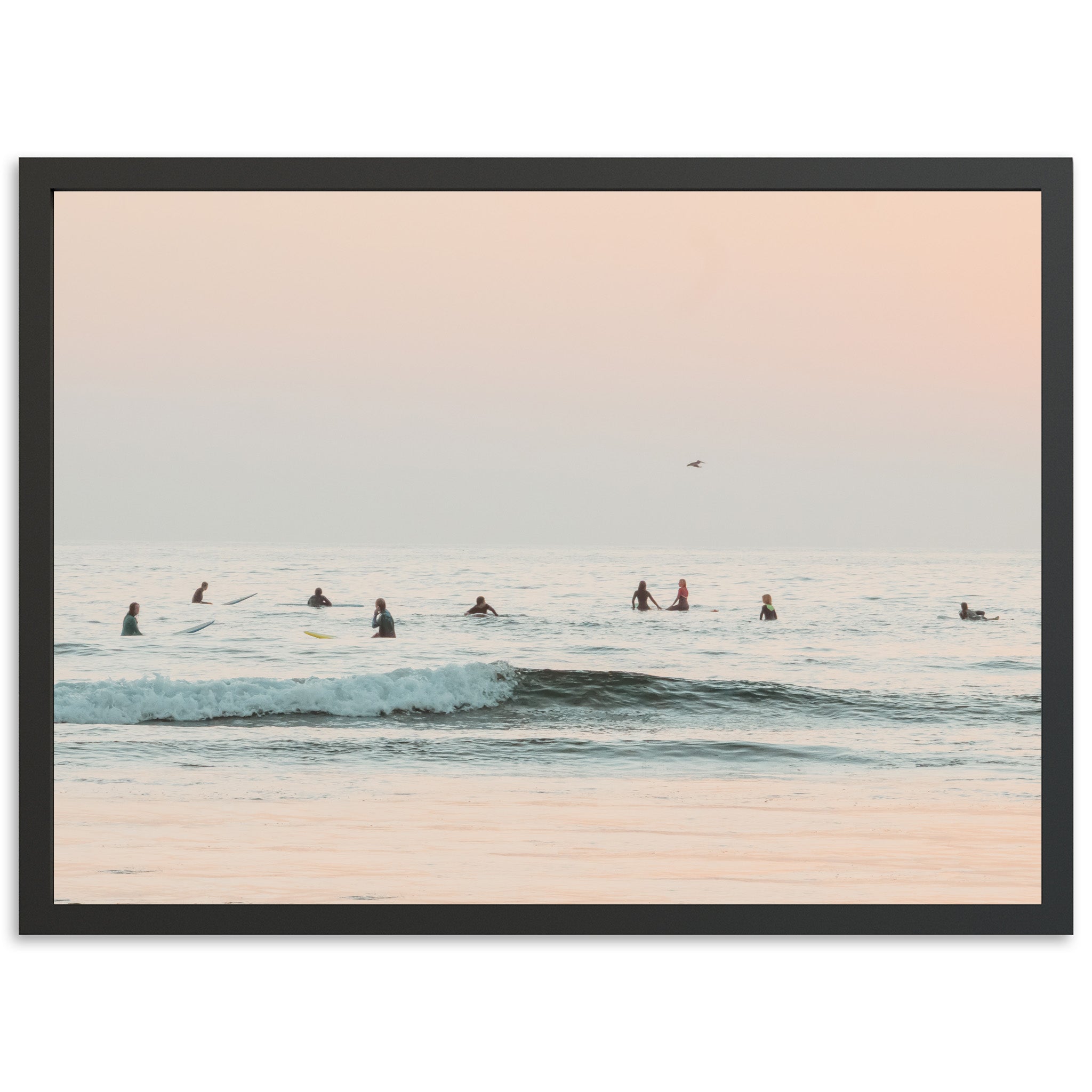 a group of people riding surfboards on top of a wave