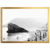 a black and white photo of people on a beach