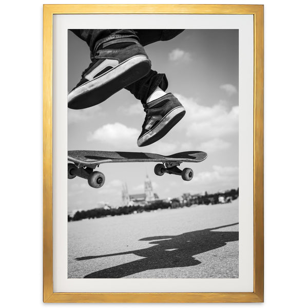 a black and white photo of a person jumping a skateboard