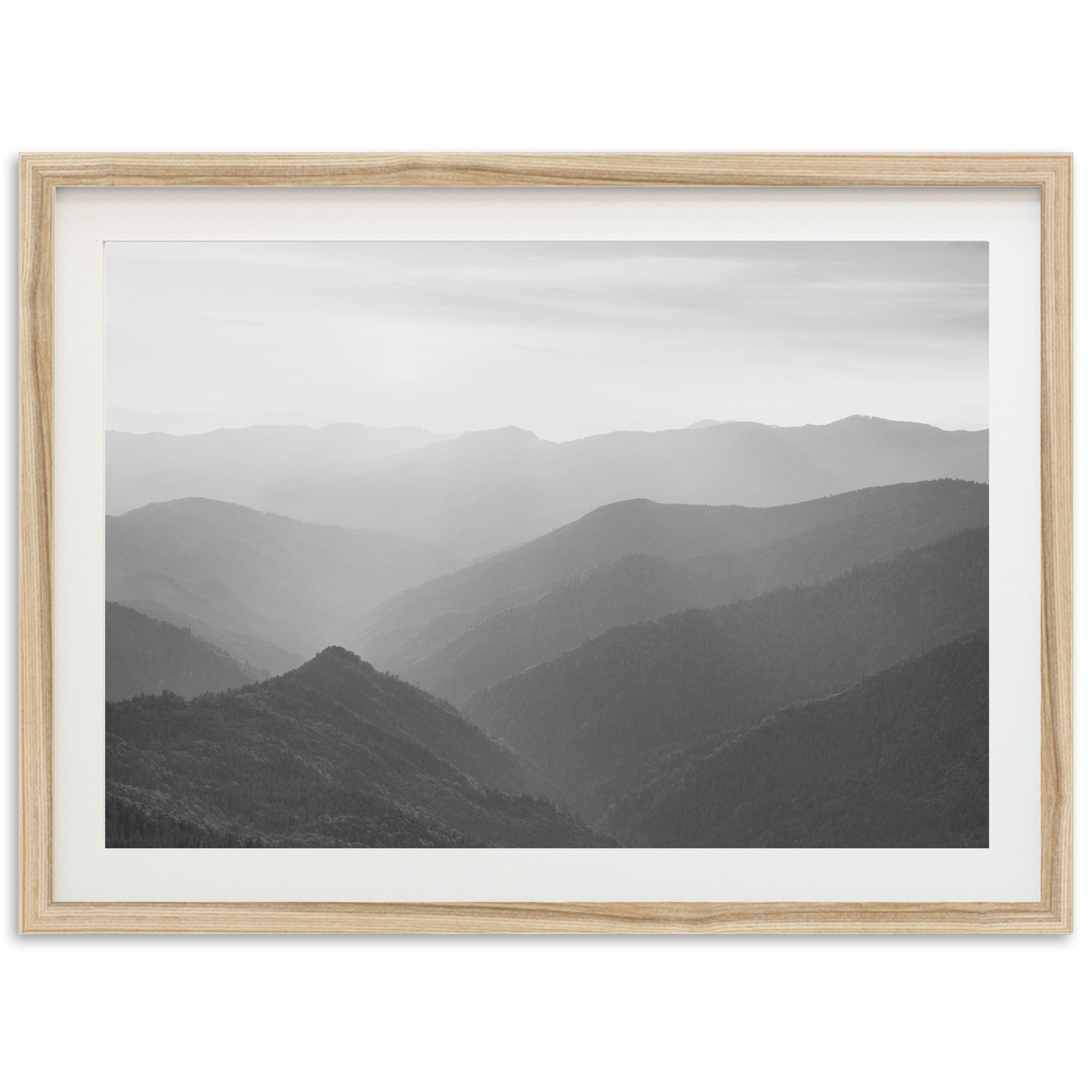 a black and white photo of a mountain range