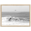 a black and white photo of a boat in the ocean