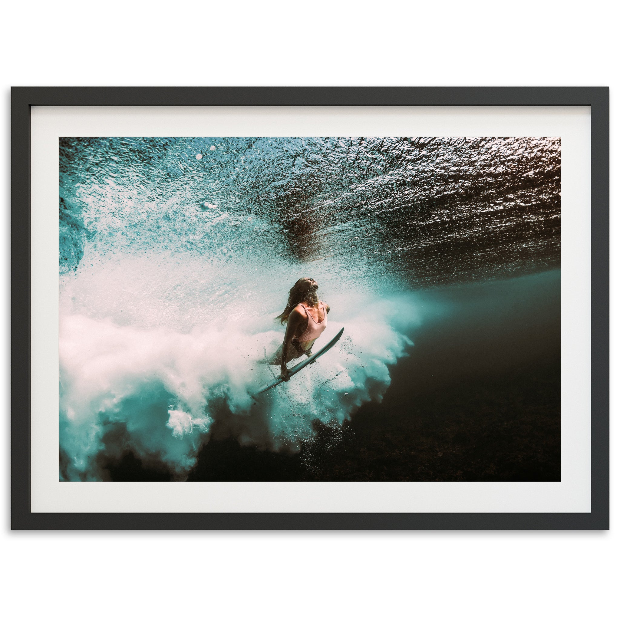 a man riding a wave on top of a surfboard