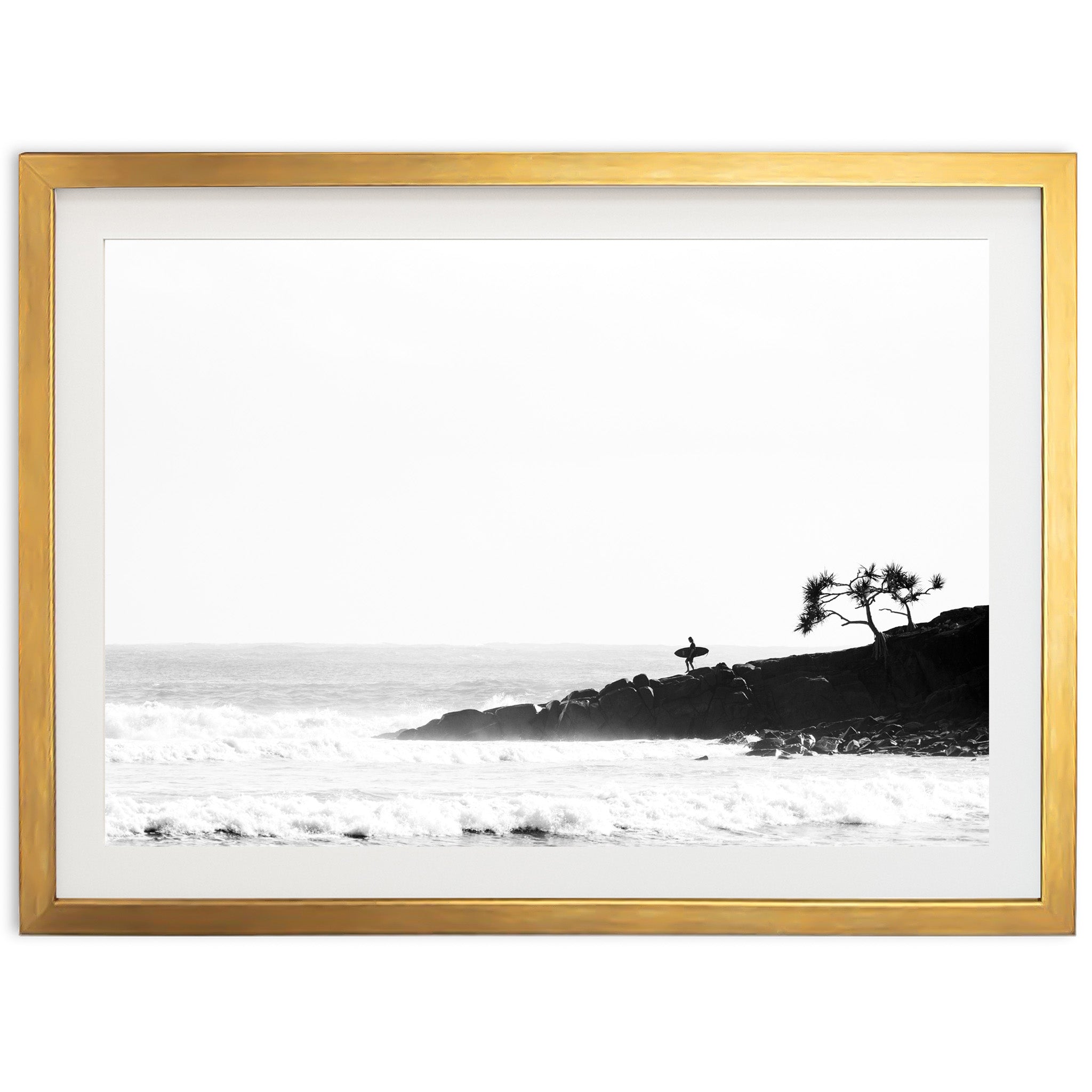 a black and white photo of a beach with waves