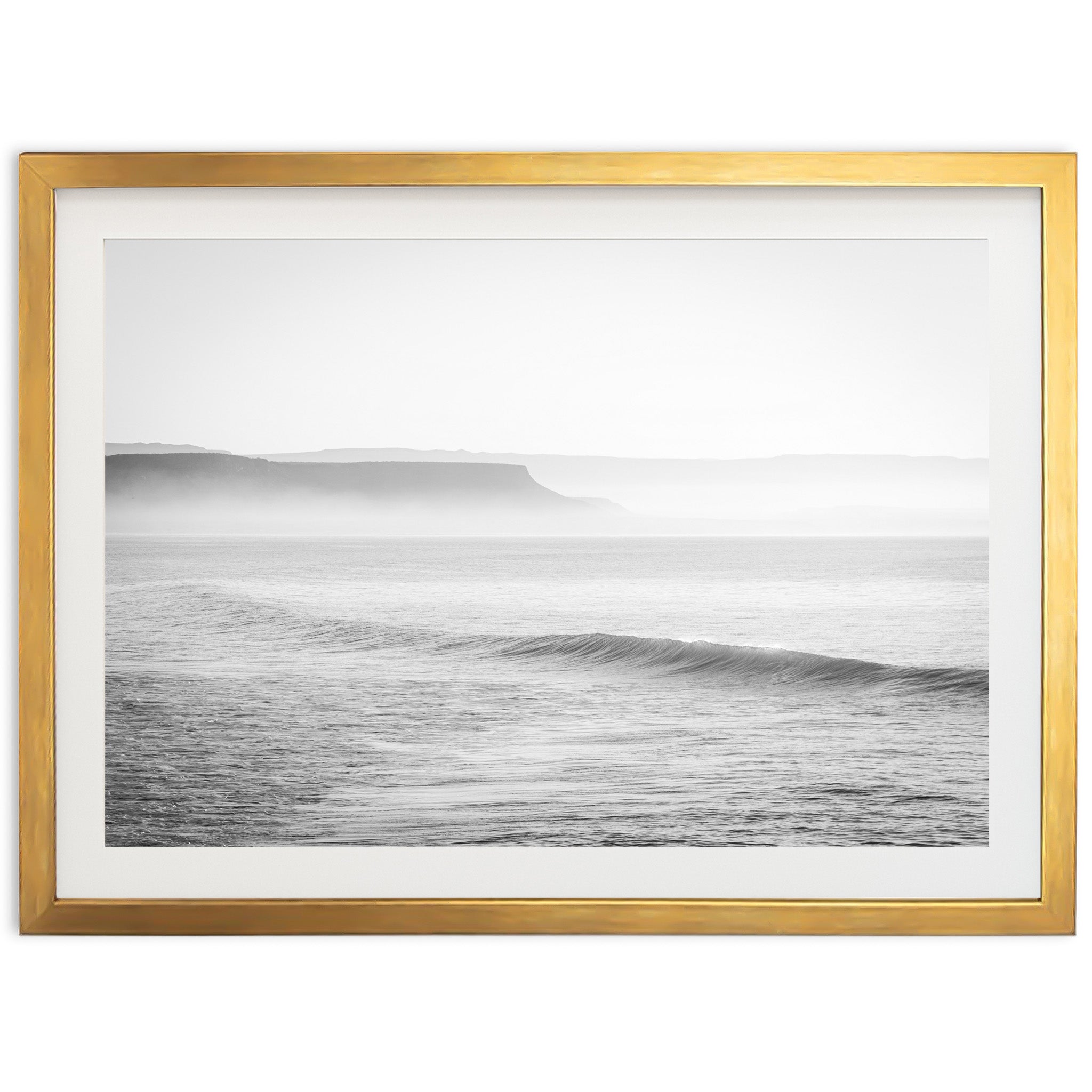 a black and white photo of a wave in the ocean