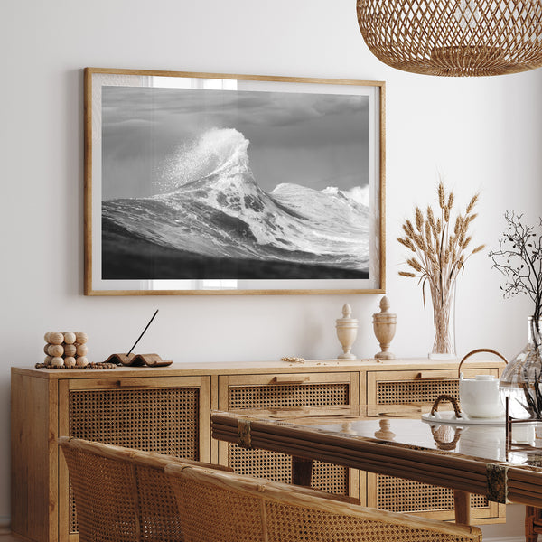 a black and white photo of a wave in the ocean