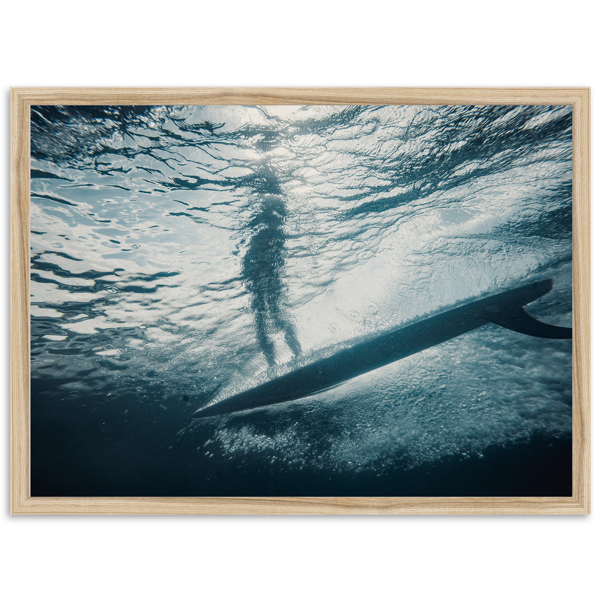 a person standing on a surfboard in the water