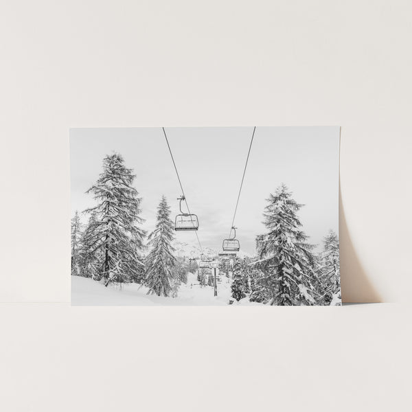 a black and white photo of a ski lift