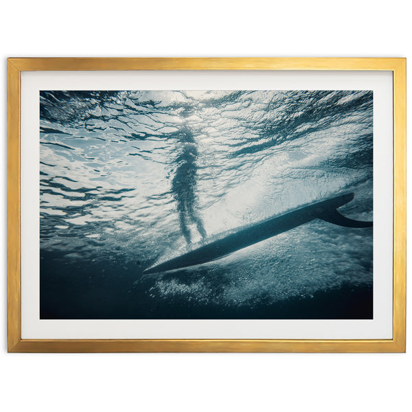 a person standing on a surfboard in the water