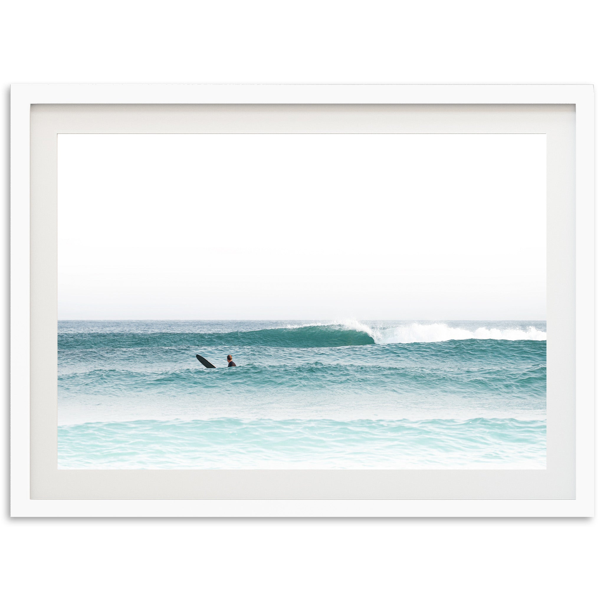 a person riding a surfboard on a wave in the ocean