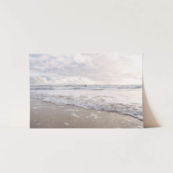 a picture of a beach with waves coming in