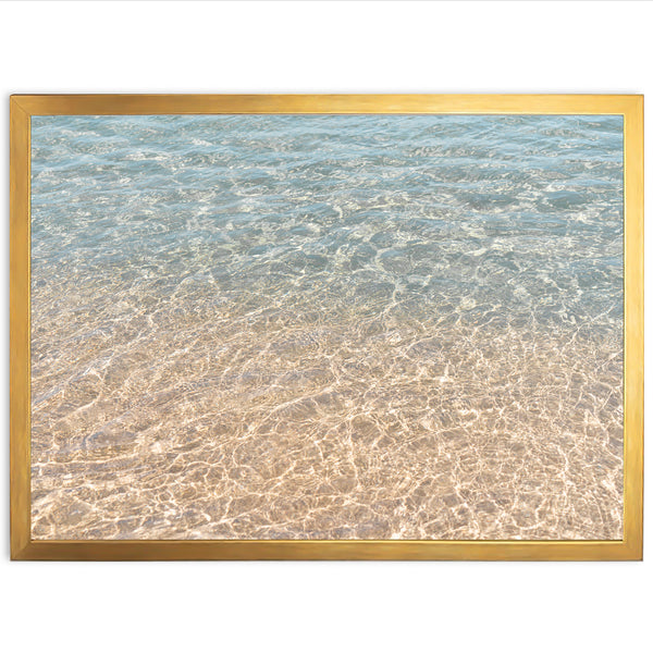 a picture of the ocean with a gold frame