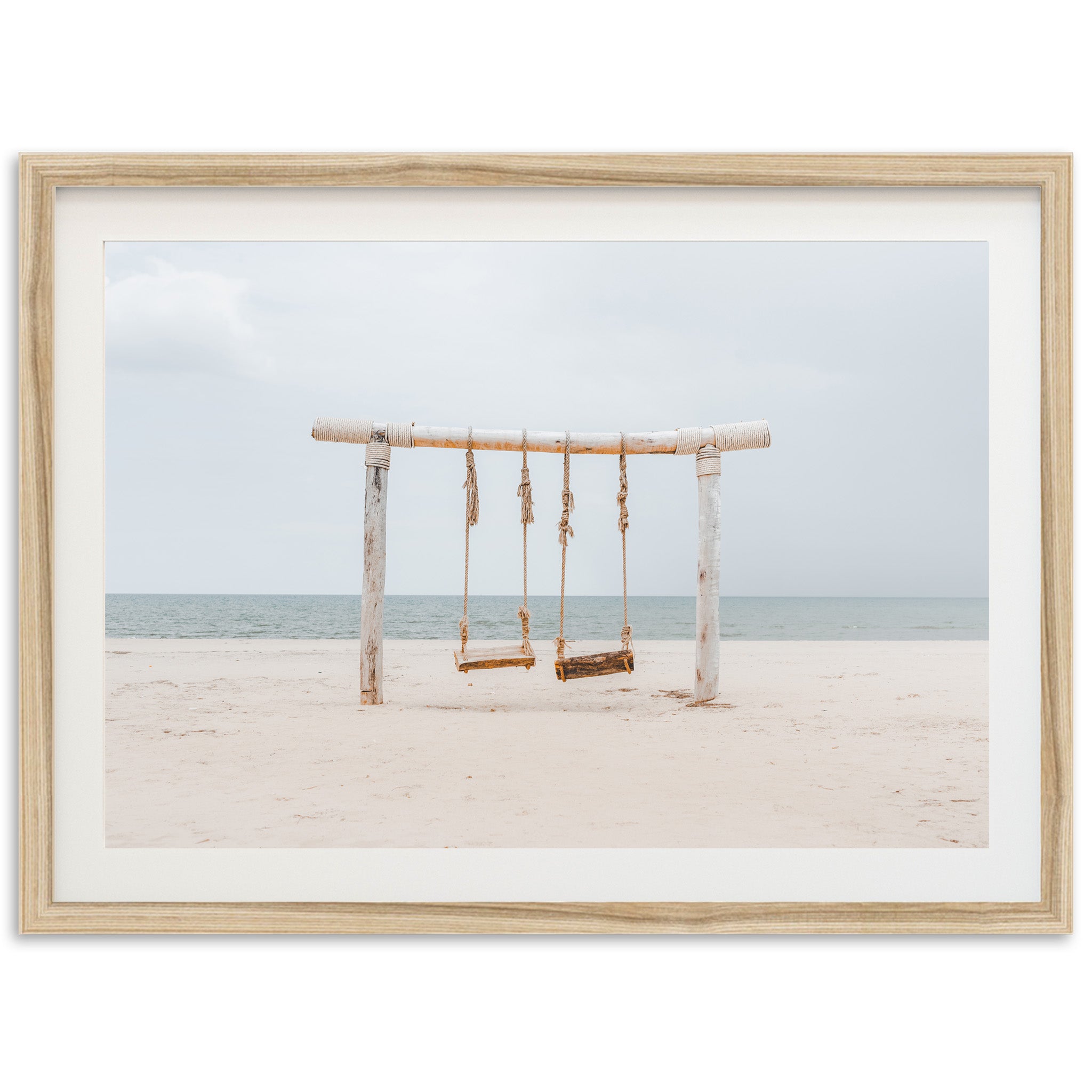 a picture of a swing set on a beach