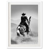 a black and white photo of a cowboy on a horse