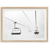 a black and white photo of a ski lift