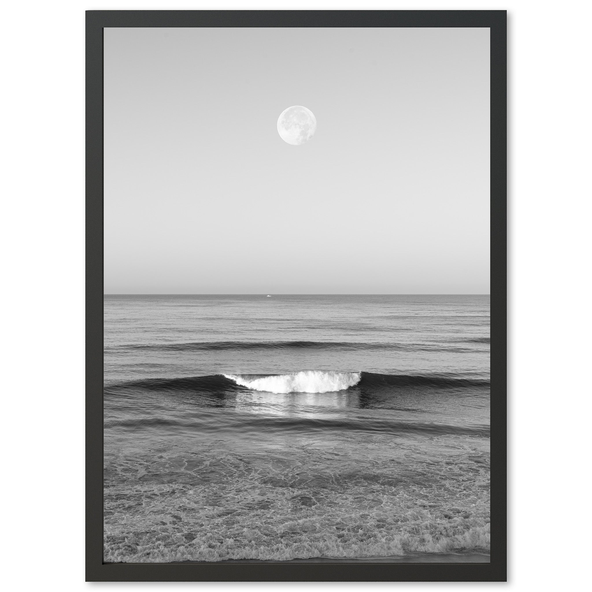 a black and white photo of a wave in the ocean