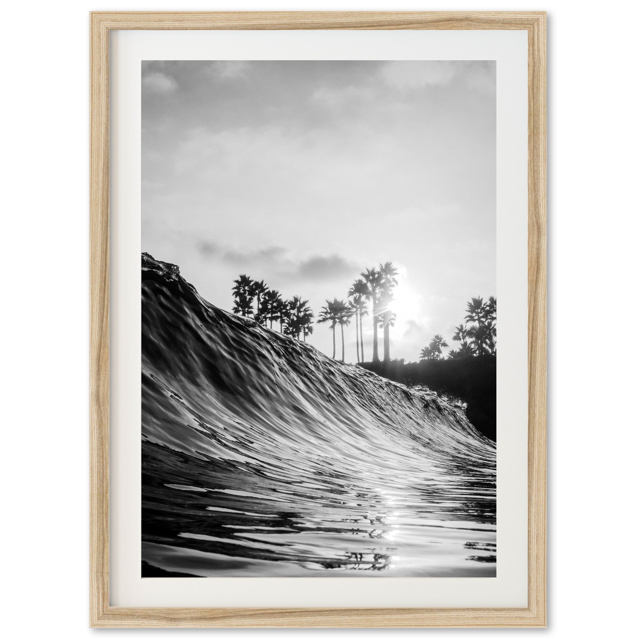 a black and white photo of a wave in the ocean