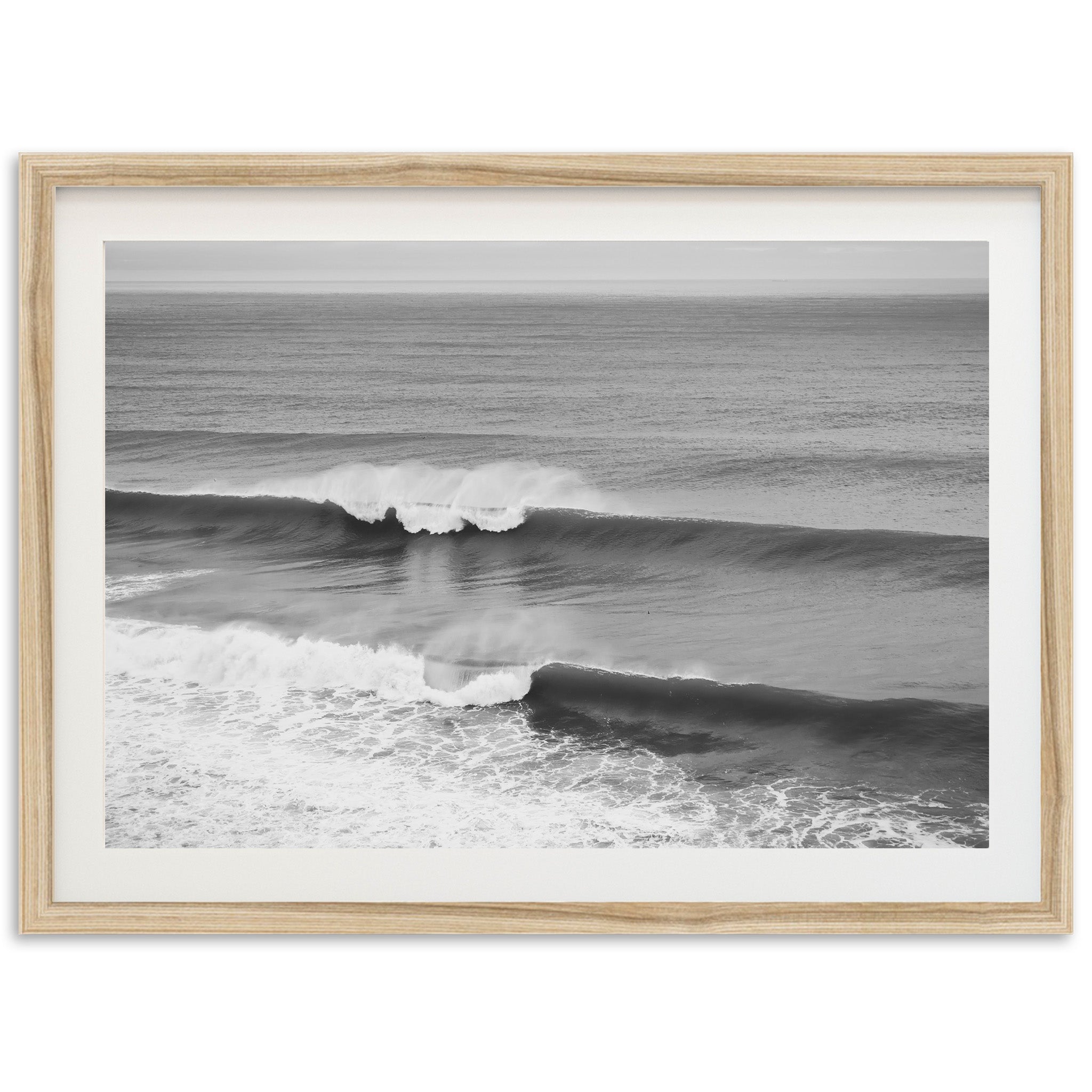 a black and white photo of a wave in the ocean