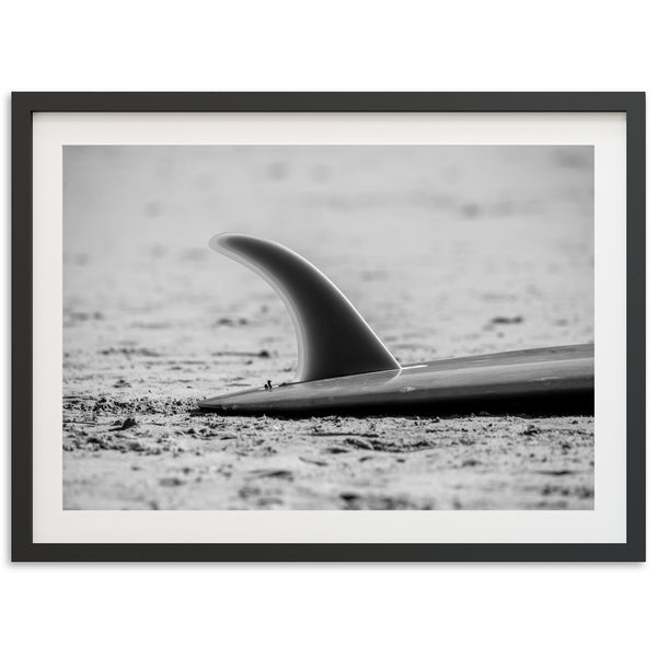 a black and white photo of a surfboard