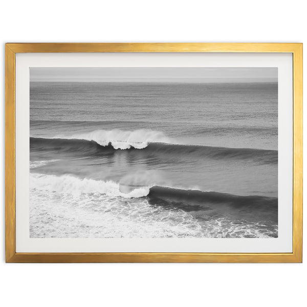 a black and white photo of a wave in the ocean