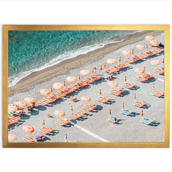 an aerial view of a beach with umbrellas and chairs