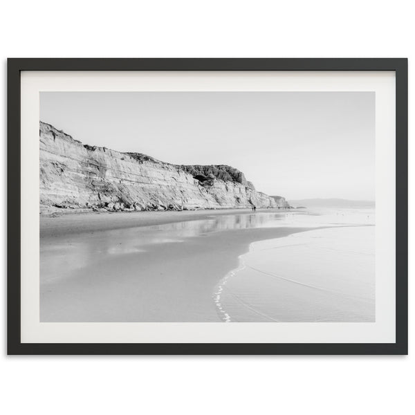 a black and white photo of a beach