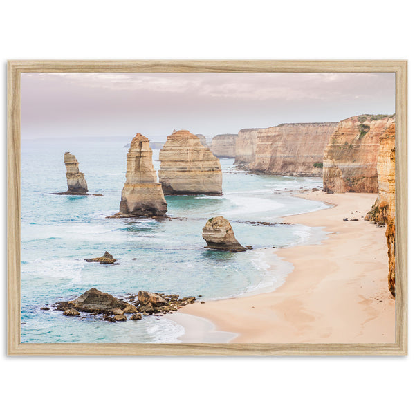 a picture of a beach with some rocks in the water