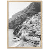 a black and white photo of a village on a cliff