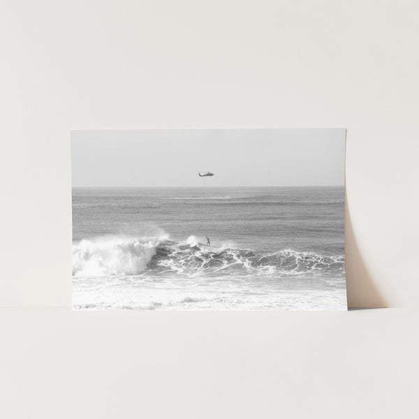 a black and white photo of a boat in the ocean