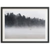 a picture of a person standing on a beach in the fog