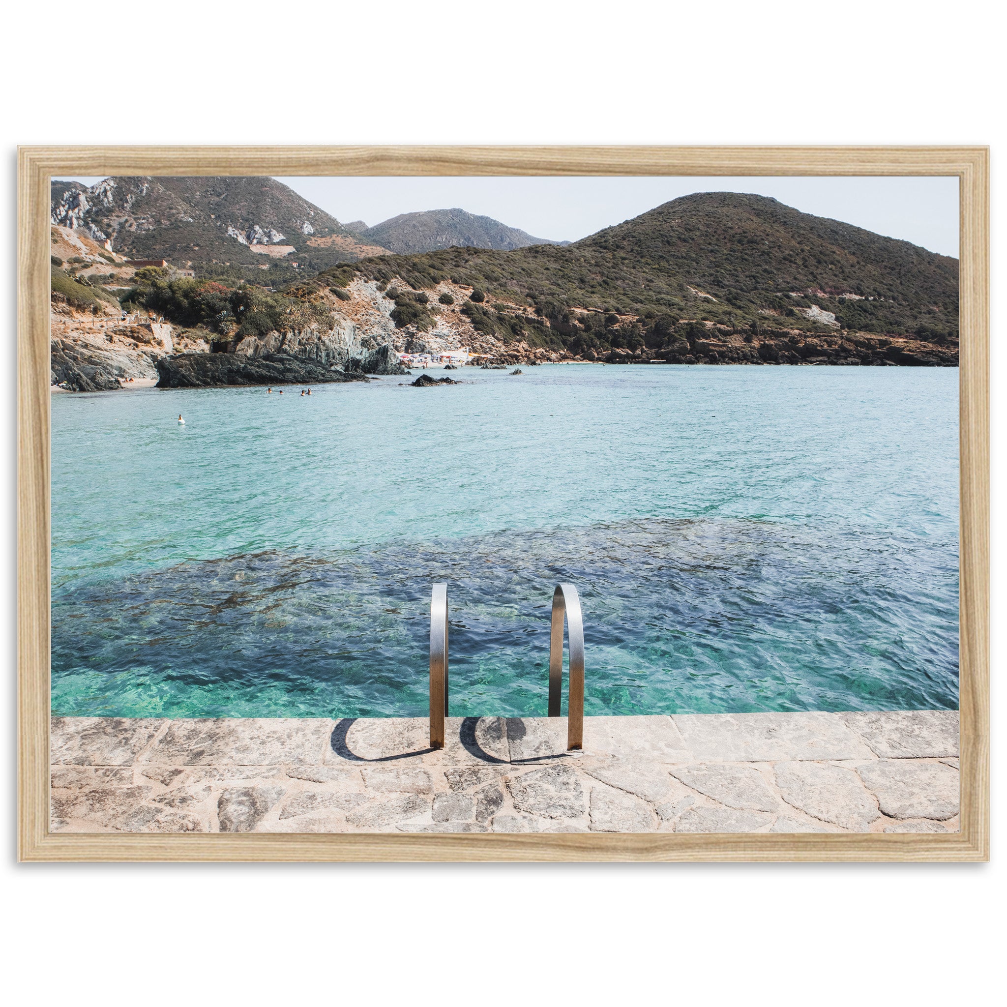 a pair of metal railings sitting in front of a body of water