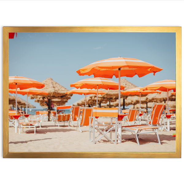 a bunch of chairs and umbrellas on a beach