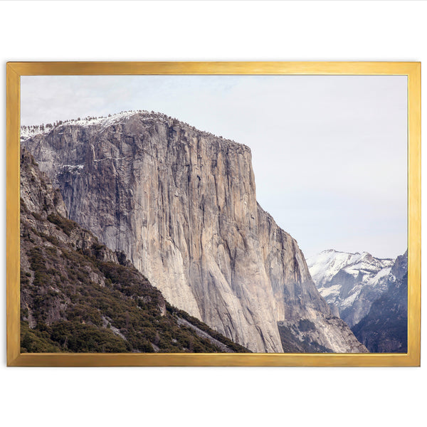 a picture of a mountain with a golden frame