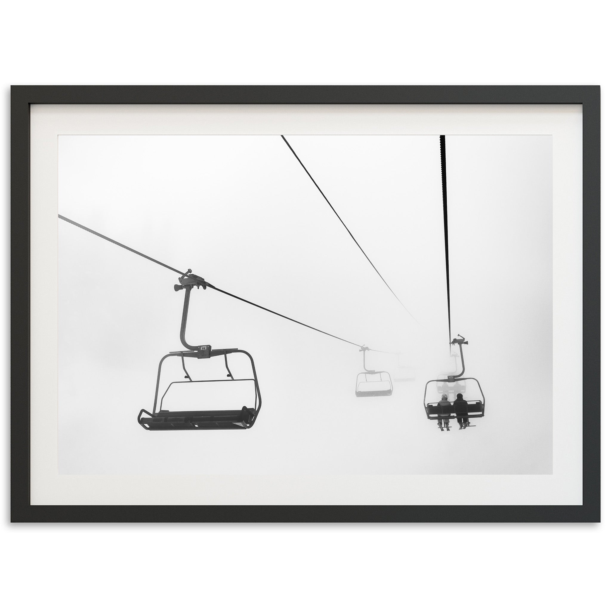 a black and white photo of a ski lift