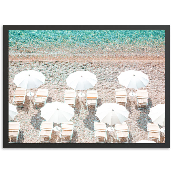 a group of chairs and umbrellas on a beach