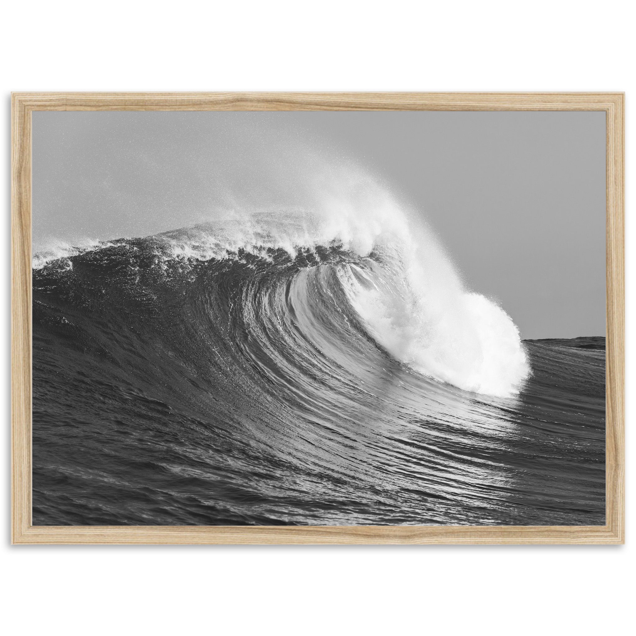 a black and white photo of a large wave