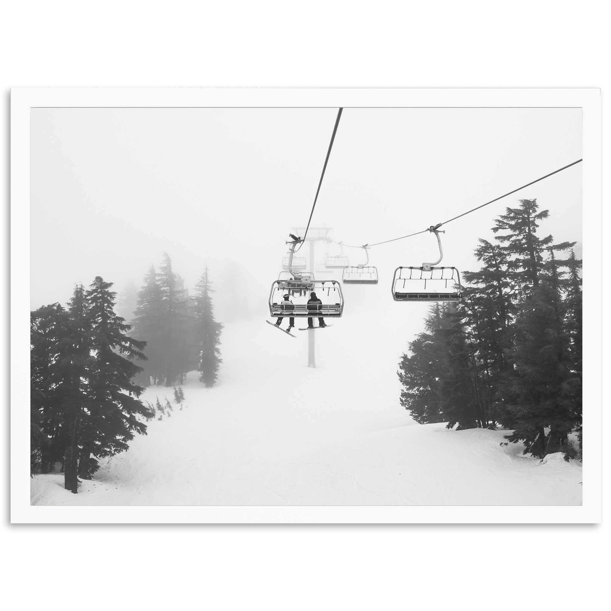 a person riding a ski lift on a snowy day