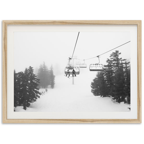 a black and white photo of a ski lift