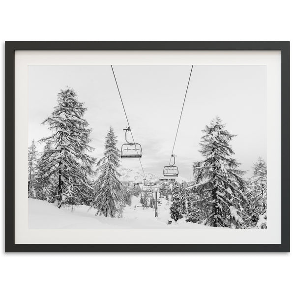 a black and white photo of a ski lift