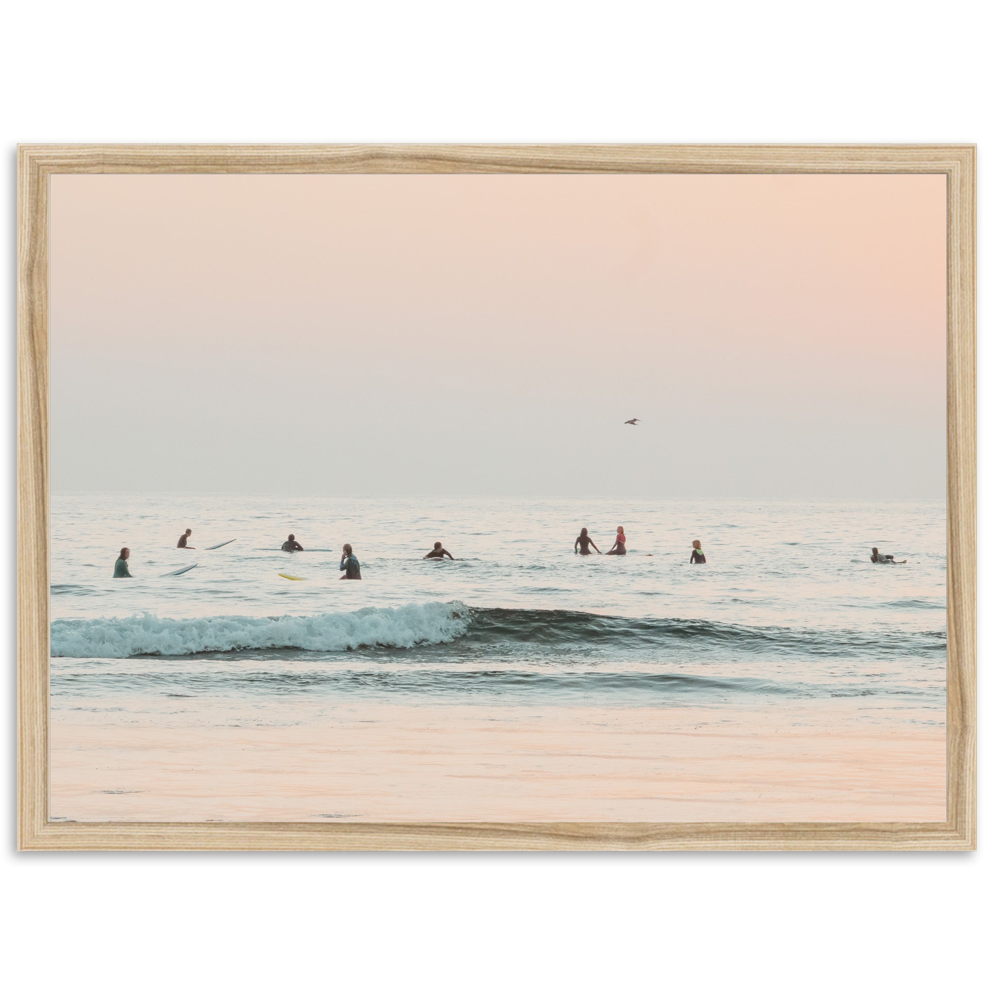 a group of people riding surfboards on top of a wave