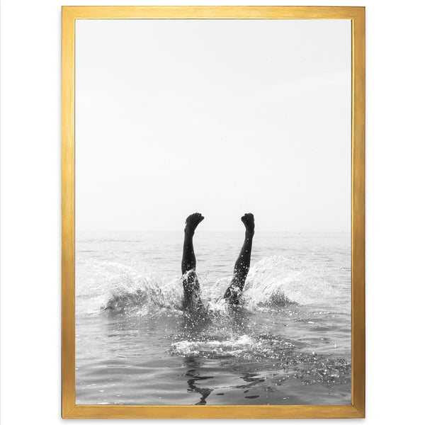 a black and white photo of a person in the water