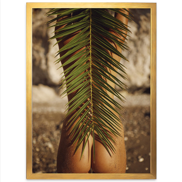 a picture of a woman's butt with a palm leaf