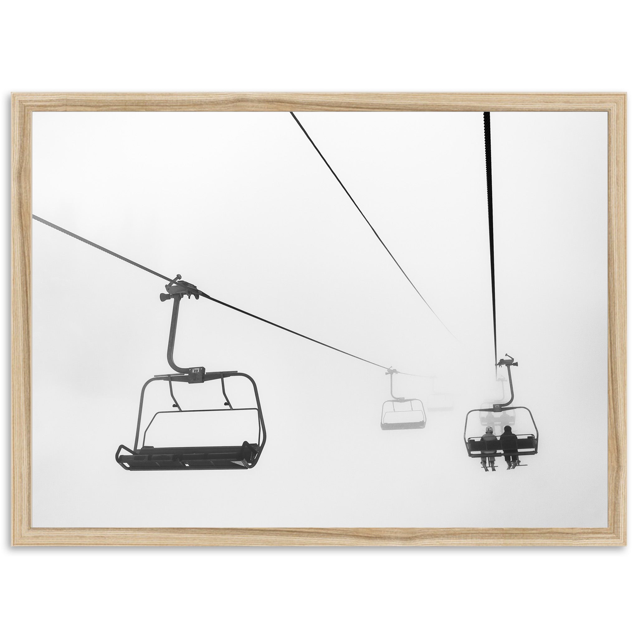 a black and white photo of a ski lift