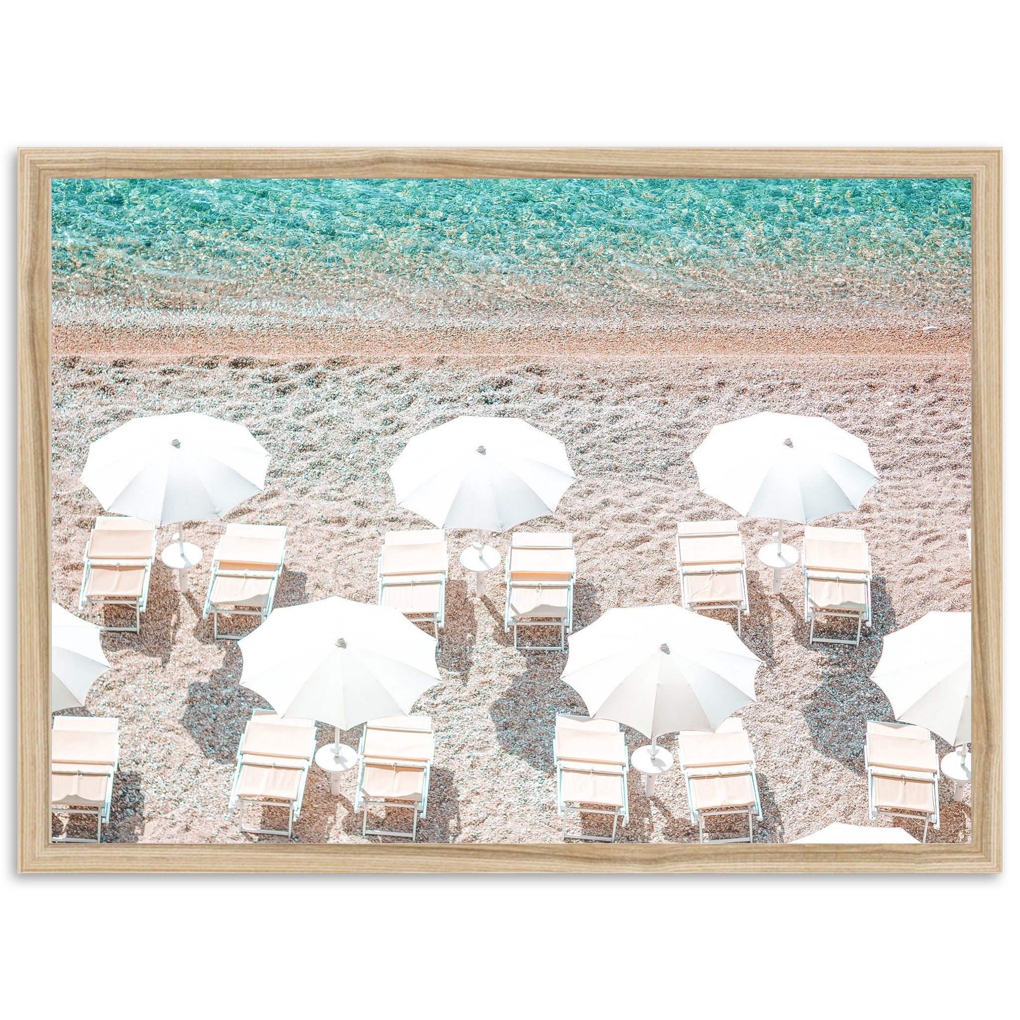 a group of beach chairs and umbrellas on a beach