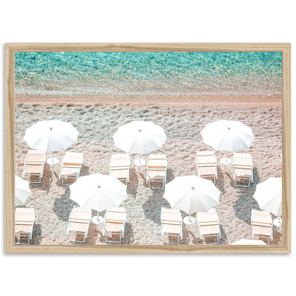 a group of beach chairs and umbrellas on a beach