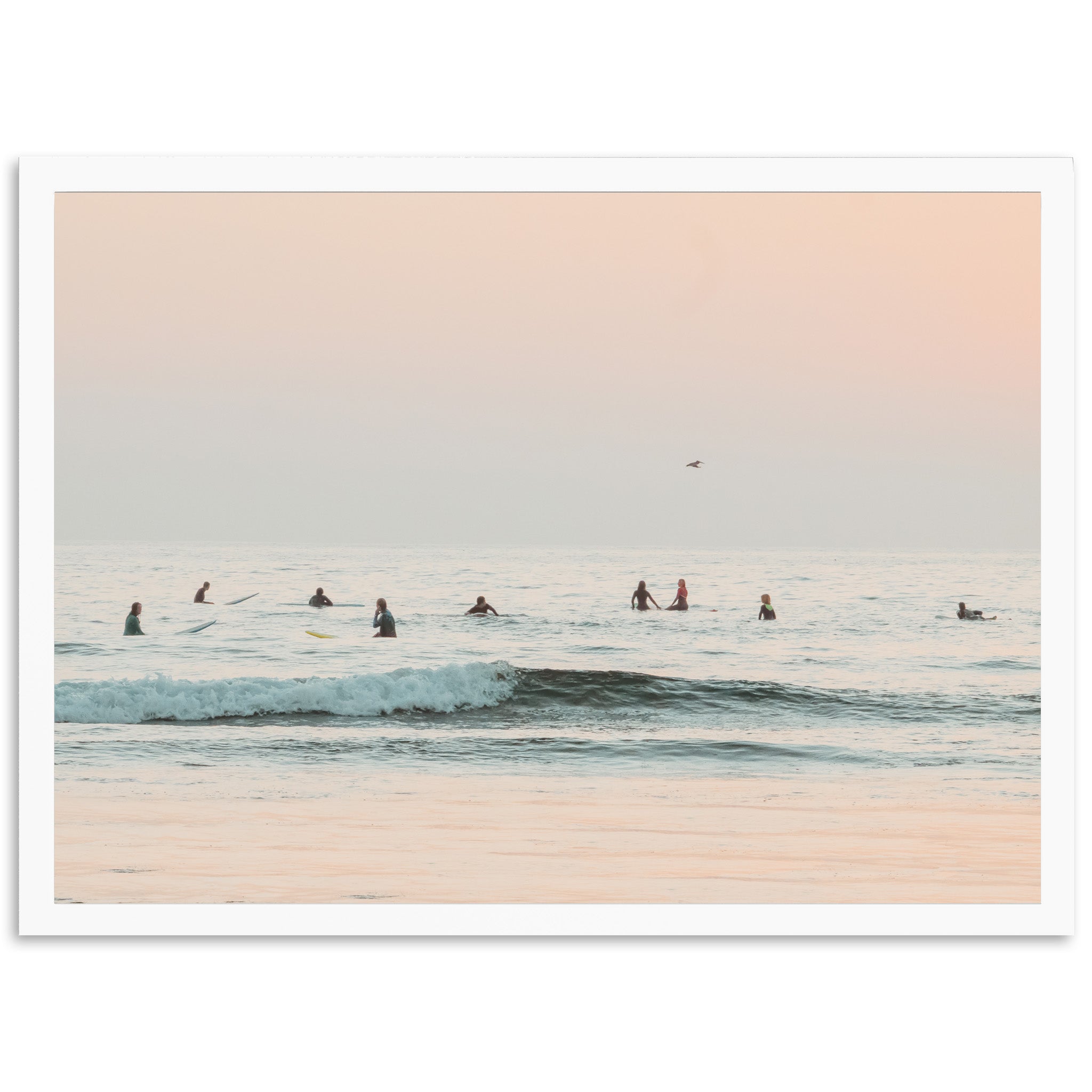 a group of people riding surfboards on top of a wave