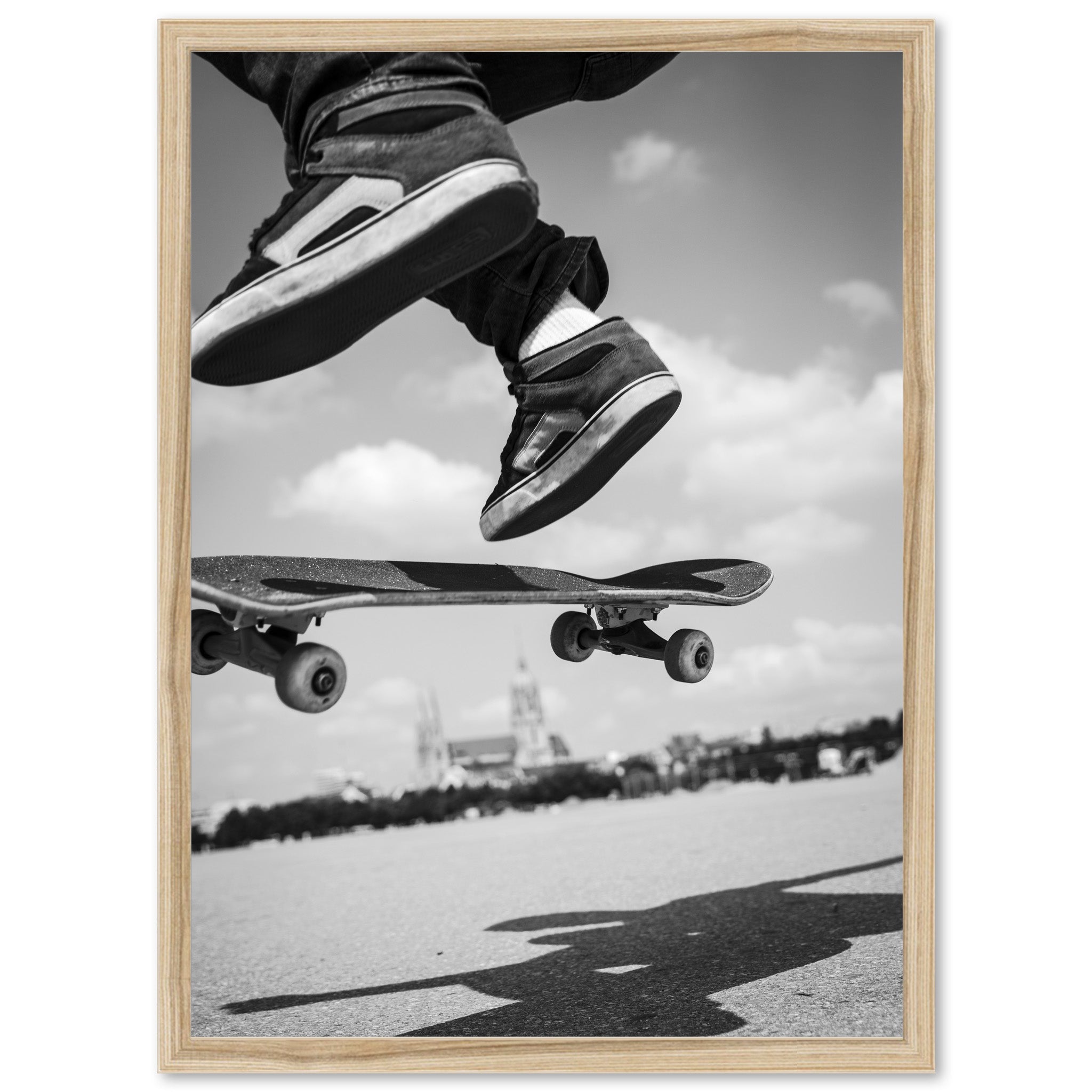 a black and white photo of a person jumping on a skateboard