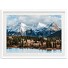 a picture of a mountain range with a lake in the foreground